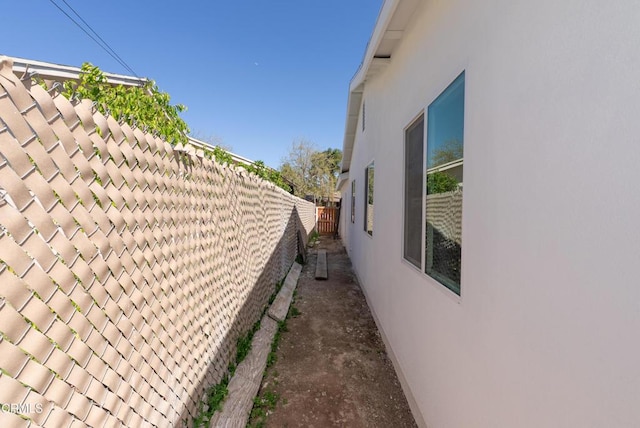 8751 Odessa Ave, North Hills, CA 91343 - view of side of home featuring stucco siding