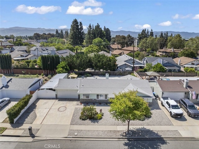 birds eye view of property featuring a mountain view and a residential view