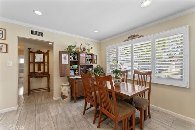 dining area featuring visible vents, recessed lighting, and ornamental molding