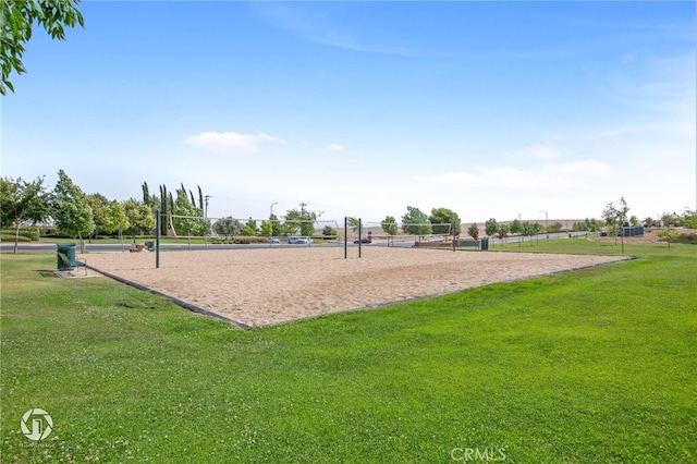 5206 Village Green Ln, Bakersfield, CA 93306 - surrounding community with volleyball court and a lawn