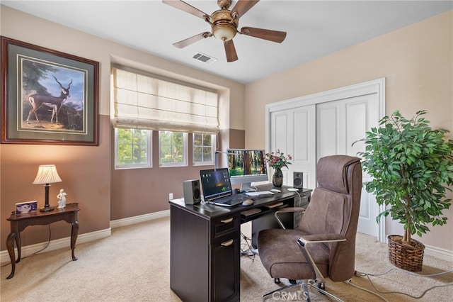 office area with light carpet, baseboards, visible vents, and a ceiling fan