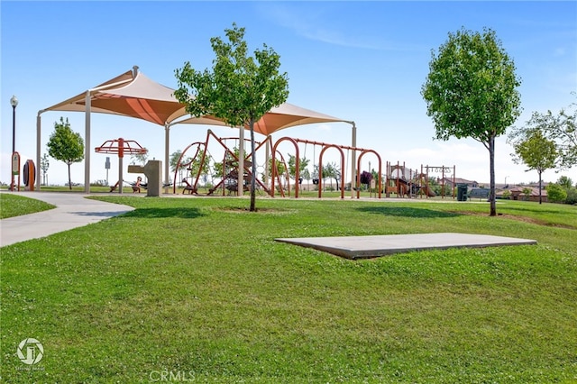 surrounding community featuring a lawn and playground community