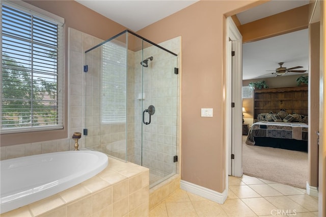 bathroom featuring ensuite bathroom, a stall shower, a bath, baseboards, and tile patterned flooring