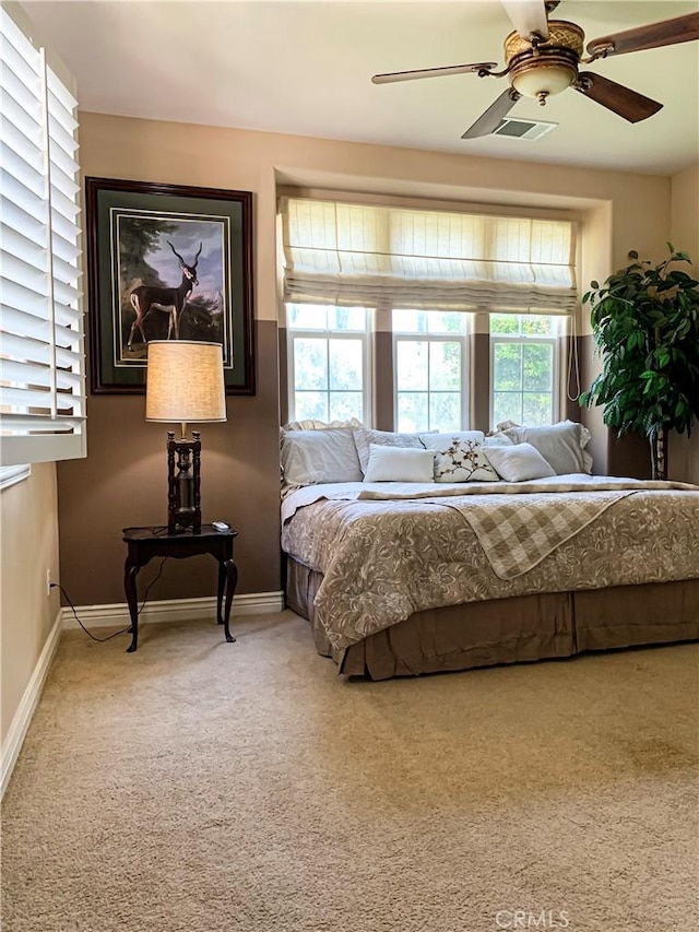 5206 Village Green Ln, Bakersfield, CA 93306 - carpeted bedroom with baseboards and ceiling fan