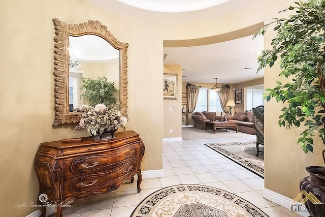 5206 Village Green Ln, Bakersfield, CA 93306 - foyer with light tile patterned floors and baseboards