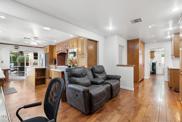 living room featuring ceiling fan, recessed lighting, hardwood / wood-style floors, and visible vents