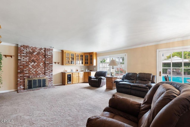 living area featuring crown molding, wet bar, a wealth of natural light, and wine cooler