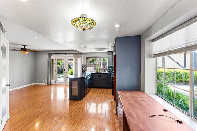 kitchen with light wood-style floors, ceiling fan, french doors, baseboards, and recessed lighting