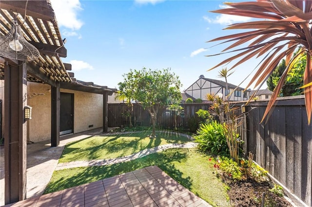 view of yard with a fenced backyard and a deck