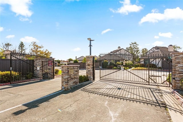 view of gate with fence