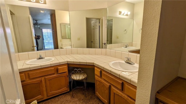 full bath featuring a sink and double vanity