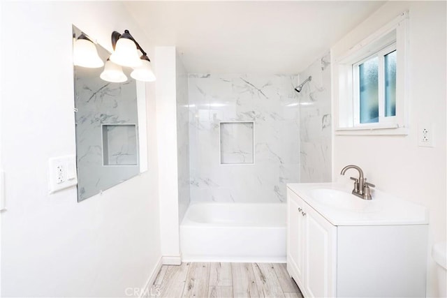 1181 W 4th St, Pomona, CA 91766 - bathroom featuring wood finished floors, vanity, and bathing tub / shower combination