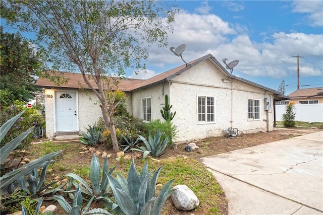 1181 W 4th St, Pomona, CA 91766 - exterior space with stucco siding, fence, and a patio