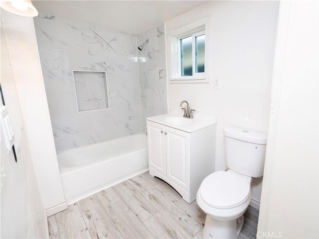 1181 W 4th St, Pomona, CA 91766 - full bathroom featuring wood finished floors, shower / bath combination, vanity, and toilet