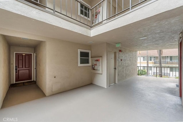 doorway to property featuring stucco siding
