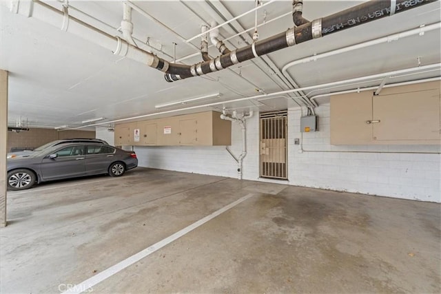 parking garage featuring a garage door opener