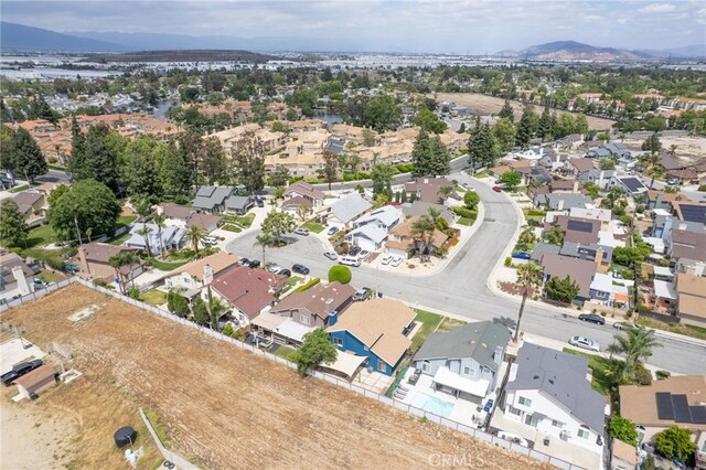 2766 Rippling Brook Pl, Ontario, CA 91761 - aerial view of property and surrounding area with nearby suburban area and mountains