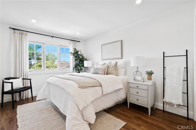 bedroom with baseboards, dark wood-type flooring, and recessed lighting