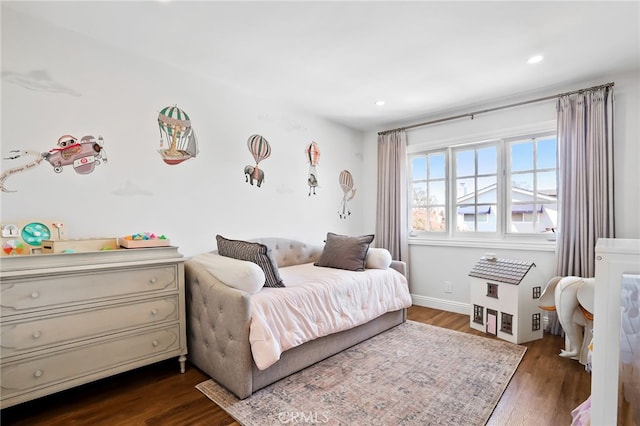 bedroom with recessed lighting, dark wood finished floors, and baseboards