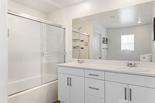 5085 Hoss Cir, Hemet, CA 92545 - full bathroom with double vanity and bath / shower combo with glass door