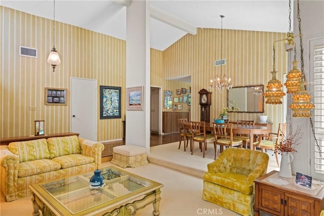 living room featuring vaulted ceiling with beams, visible vents, a wealth of natural light, and a chandelier