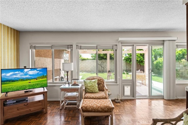 interior space with baseboards and a textured ceiling