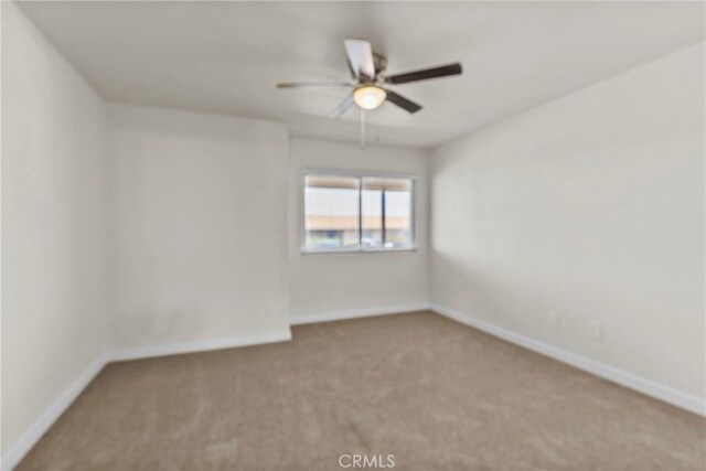 603 S Palm Ave Unit A, Hemet, CA 92543 - empty room with carpet floors, a ceiling fan, and baseboards