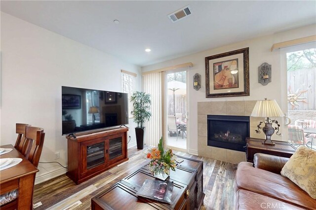 117 Village Cir, Pismo Beach, CA 93449 - living area with recessed lighting, baseboards, wood finished floors, a tile fireplace, and visible vents