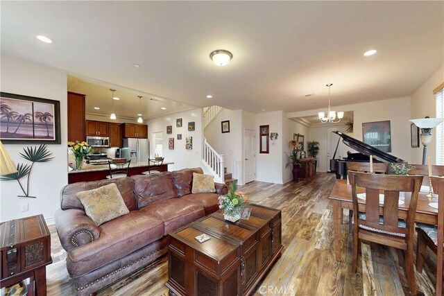 117 Village Cir, Pismo Beach, CA 93449 - living area featuring recessed lighting, stairs, light wood finished floors, and a notable chandelier