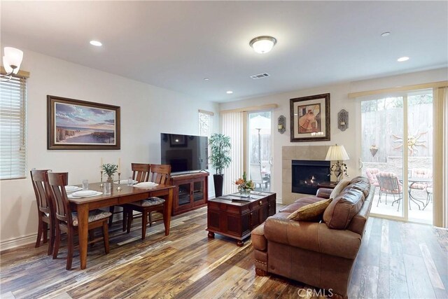 117 Village Cir, Pismo Beach, CA 93449 - living area featuring visible vents, hardwood / wood-style floors, baseboards, recessed lighting, and a tiled fireplace