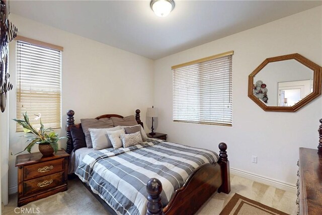 117 Village Cir, Pismo Beach, CA 93449 - bedroom featuring baseboards, multiple windows, and carpet