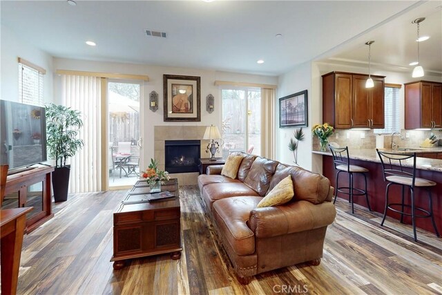 117 Village Cir, Pismo Beach, CA 93449 - living area featuring recessed lighting, visible vents, wood finished floors, and a fireplace