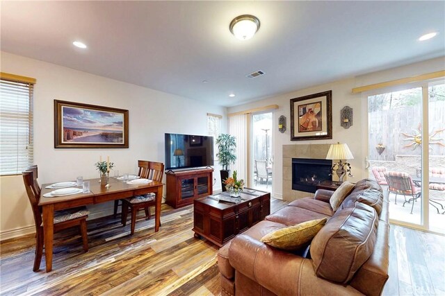 117 Village Cir, Pismo Beach, CA 93449 - living room featuring visible vents, recessed lighting, light wood-style floors, and a tiled fireplace