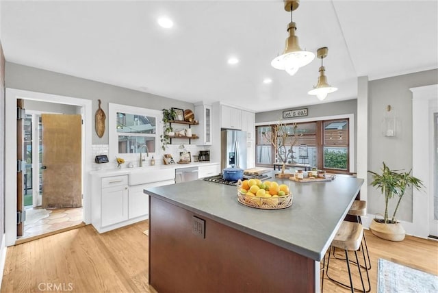 524 Walnut Ave, Long Beach, CA 90802 - kitchen featuring white cabinets, appliances with stainless steel finishes, open shelves, and a sink