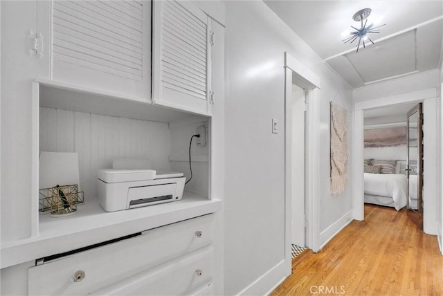 524 Walnut Ave, Long Beach, CA 90802 - hallway with light wood finished floors, attic access, and baseboards