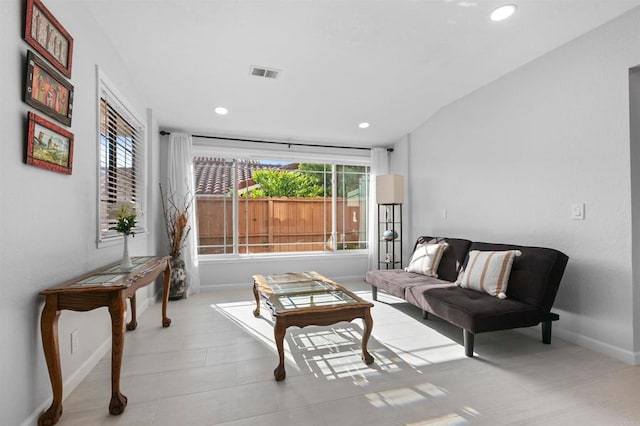 10954 Cool Lake Ter, San Diego, CA 92128 - living area featuring lofted ceiling, baseboards, visible vents, and recessed lighting