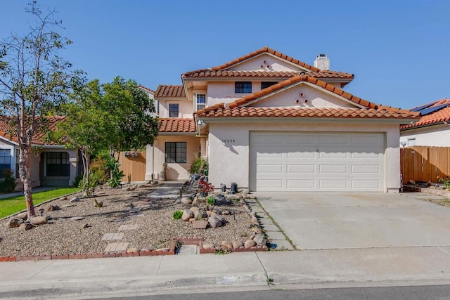 10954 Cool Lake Ter, San Diego, CA 92128 - mediterranean / spanish house featuring a tile roof, concrete driveway, fence, a garage, and stucco siding