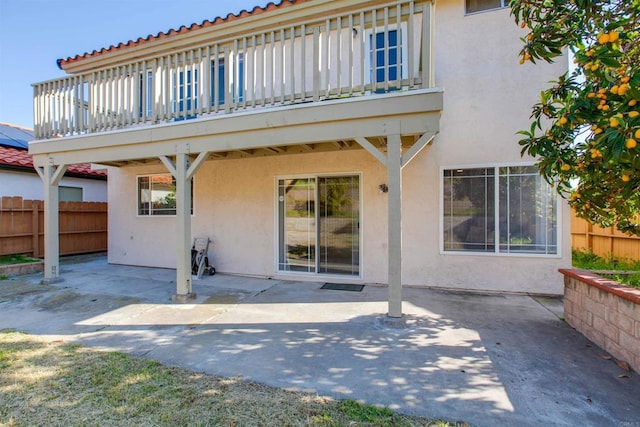 10954 Cool Lake Ter, San Diego, CA 92128 - rear view of property featuring a wooden deck, a patio, stucco siding, and fence