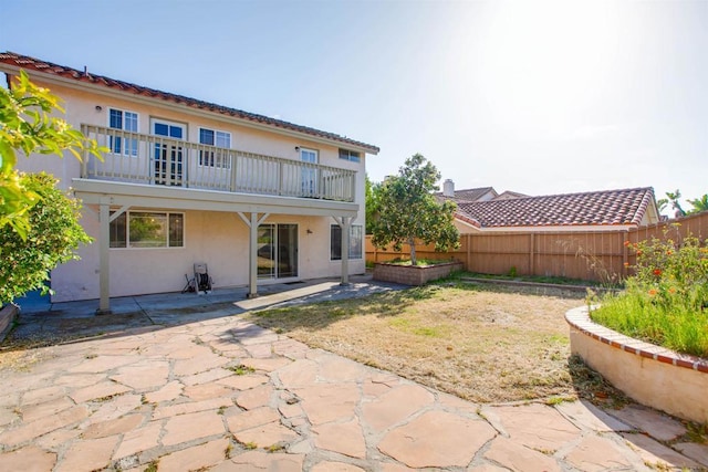 10954 Cool Lake Ter, San Diego, CA 92128 - back of property featuring a patio area, a balcony, a fenced backyard, and stucco siding