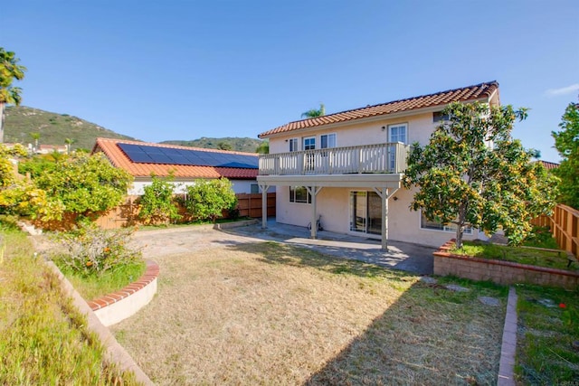 10954 Cool Lake Ter, San Diego, CA 92128 - back of house with stucco siding, a patio, a fenced backyard, and a lawn