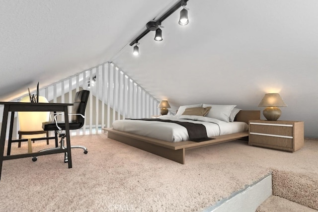 carpeted bedroom with rail lighting and vaulted ceiling
