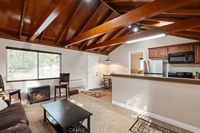 carpeted living area featuring a warm lit fireplace, vaulted ceiling with beams, and baseboards