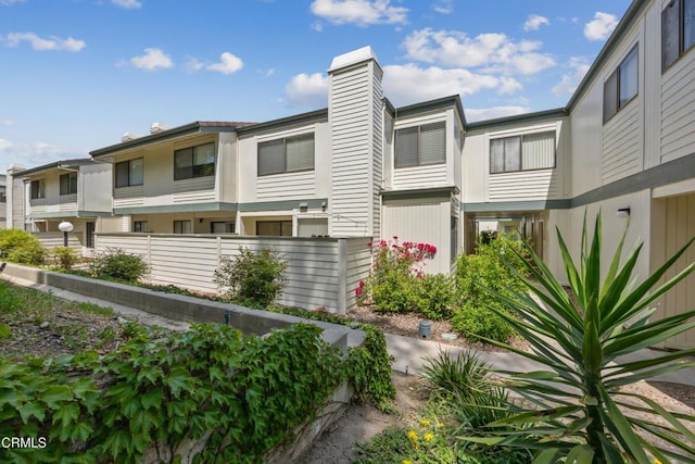 10508 Sunland Blvd Unit 4, Sunland, CA 91040 - view of front of house featuring a chimney and fence