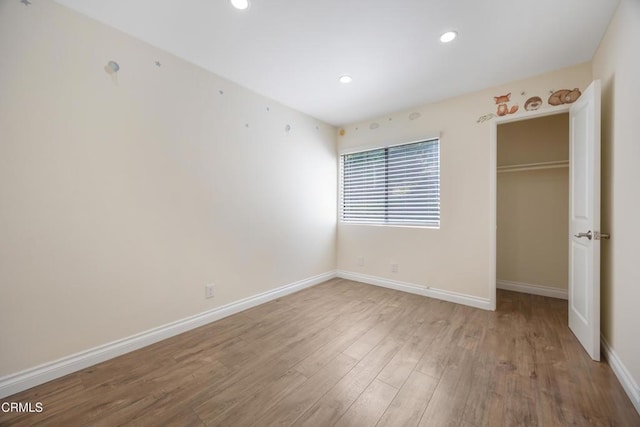 10508 Sunland Blvd Unit 4, Sunland, CA 91040 - unfurnished bedroom featuring baseboards, a closet, wood finished floors, and recessed lighting