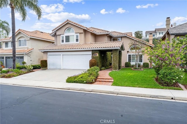 mediterranean / spanish home featuring a tile roof, a garage, stucco siding, a front yard, and driveway