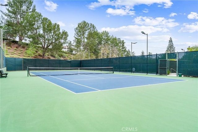 view of sport court featuring community basketball court and fence