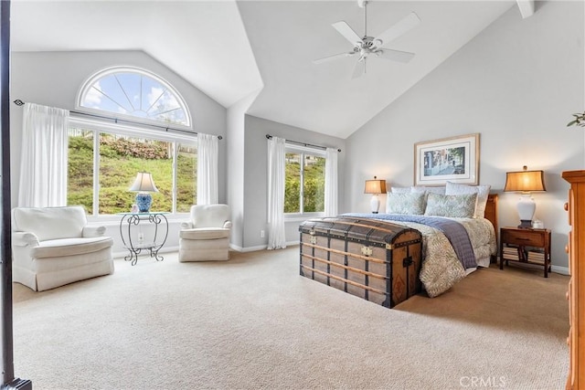 carpeted bedroom featuring high vaulted ceiling, baseboards, and a ceiling fan