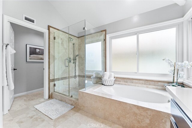 full bathroom with a bath, visible vents, a shower stall, baseboards, and lofted ceiling