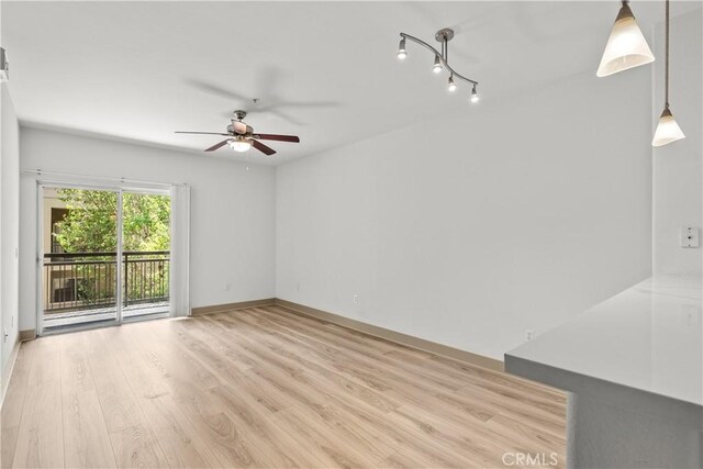 24535 Town Center Dr Unit 6309, Valencia, CA 91355 - spare room featuring ceiling fan, light wood-style floors, and baseboards