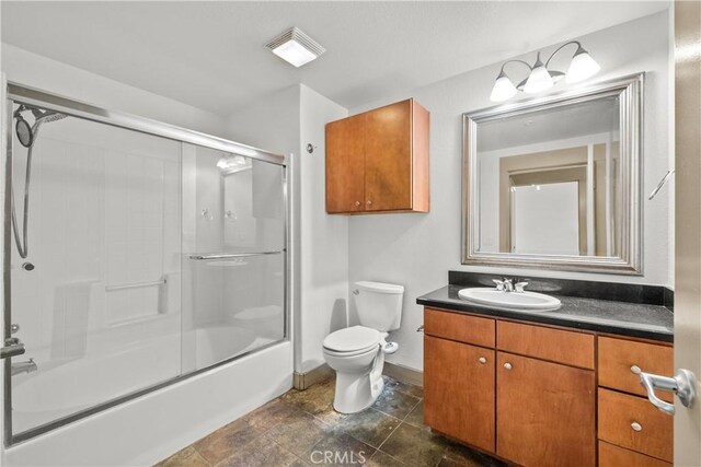 24535 Town Center Dr Unit 6309, Valencia, CA 91355 - full bath featuring vanity, toilet, shower / bath combination with glass door, and baseboards